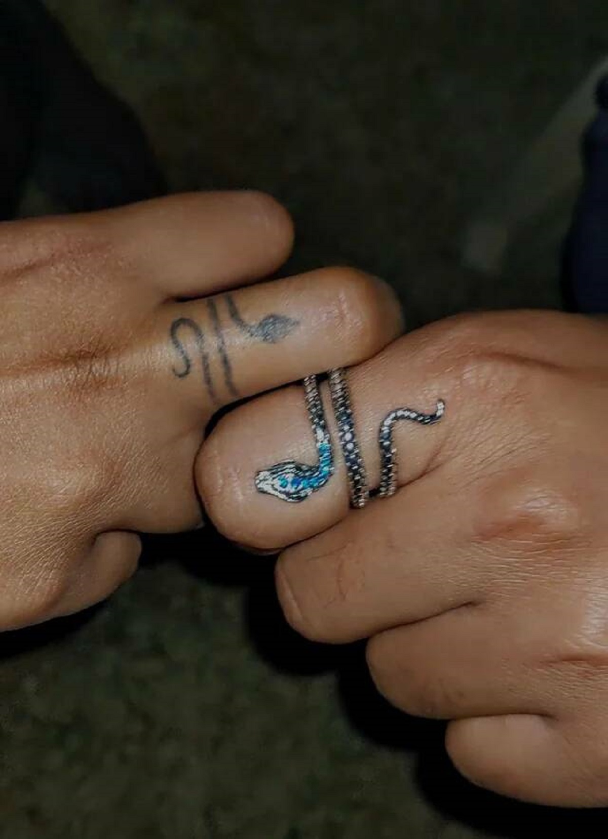 "Stranger's tattoo that matched my buddy's snake ring"