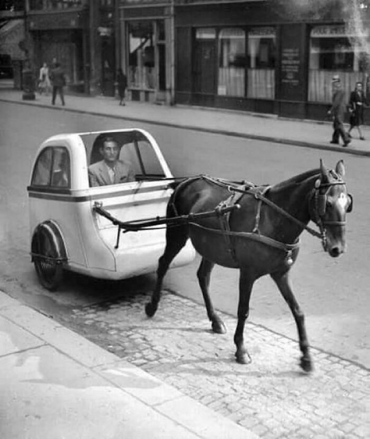 An Ultra Light Horse-Drawn Car In Traffic Paris (1943)