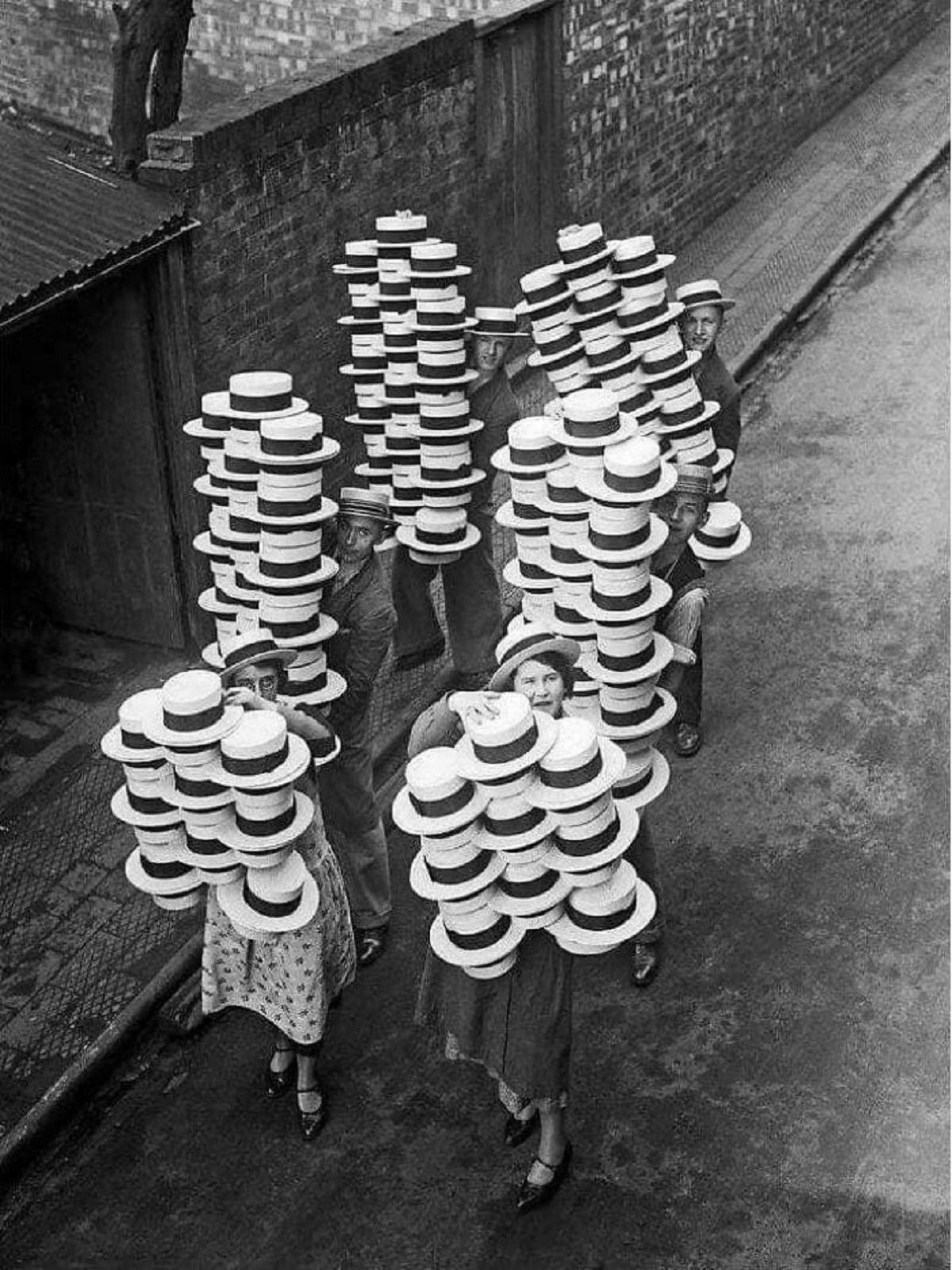 Straw Hats Made By Messrs Olney's Of Luton, Bedfordshire Being Carried To The Packing Rooms, 1933