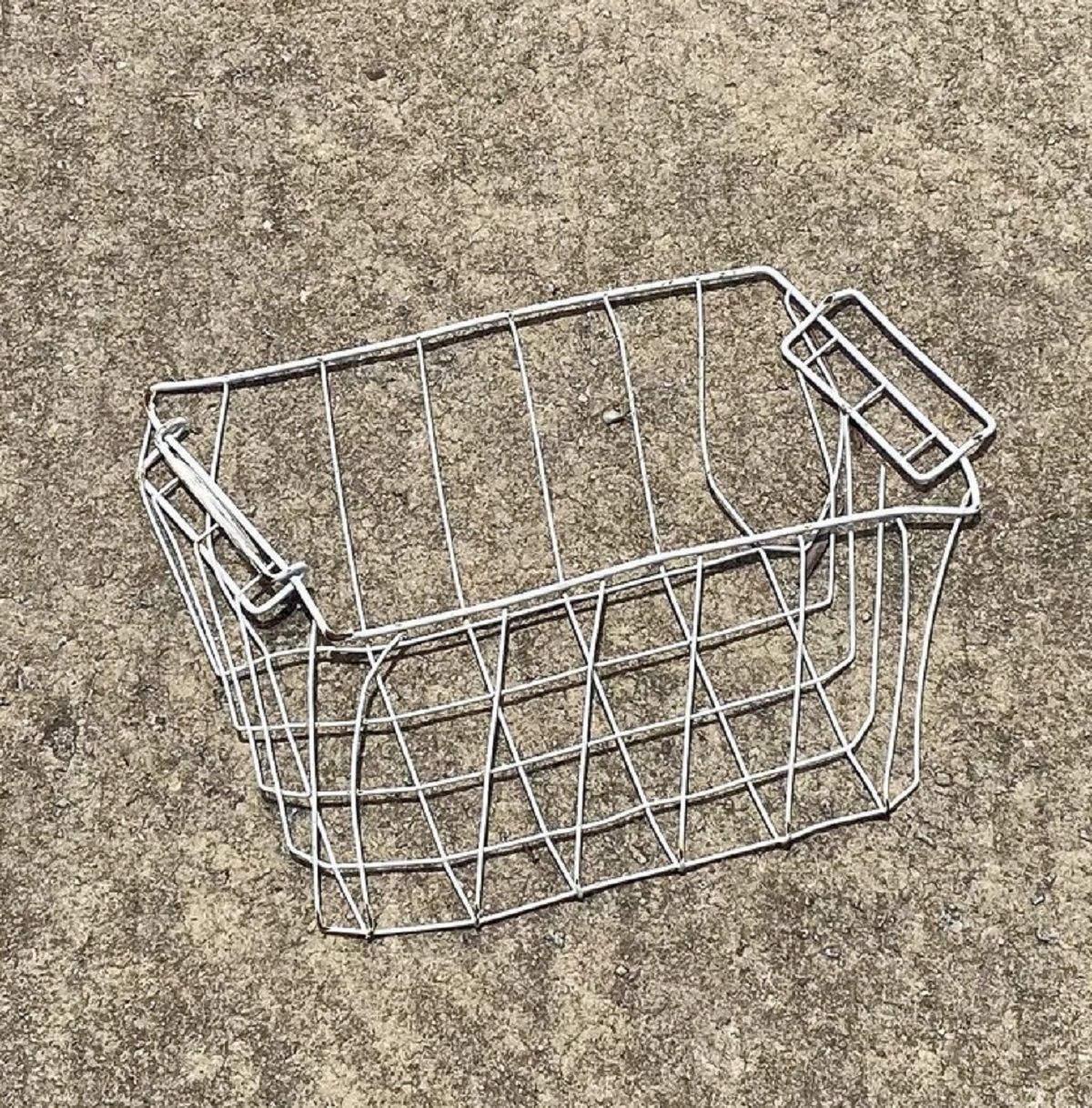 “This basket, flattened by a semi truck, now looks like a 3D picture of a basket.”