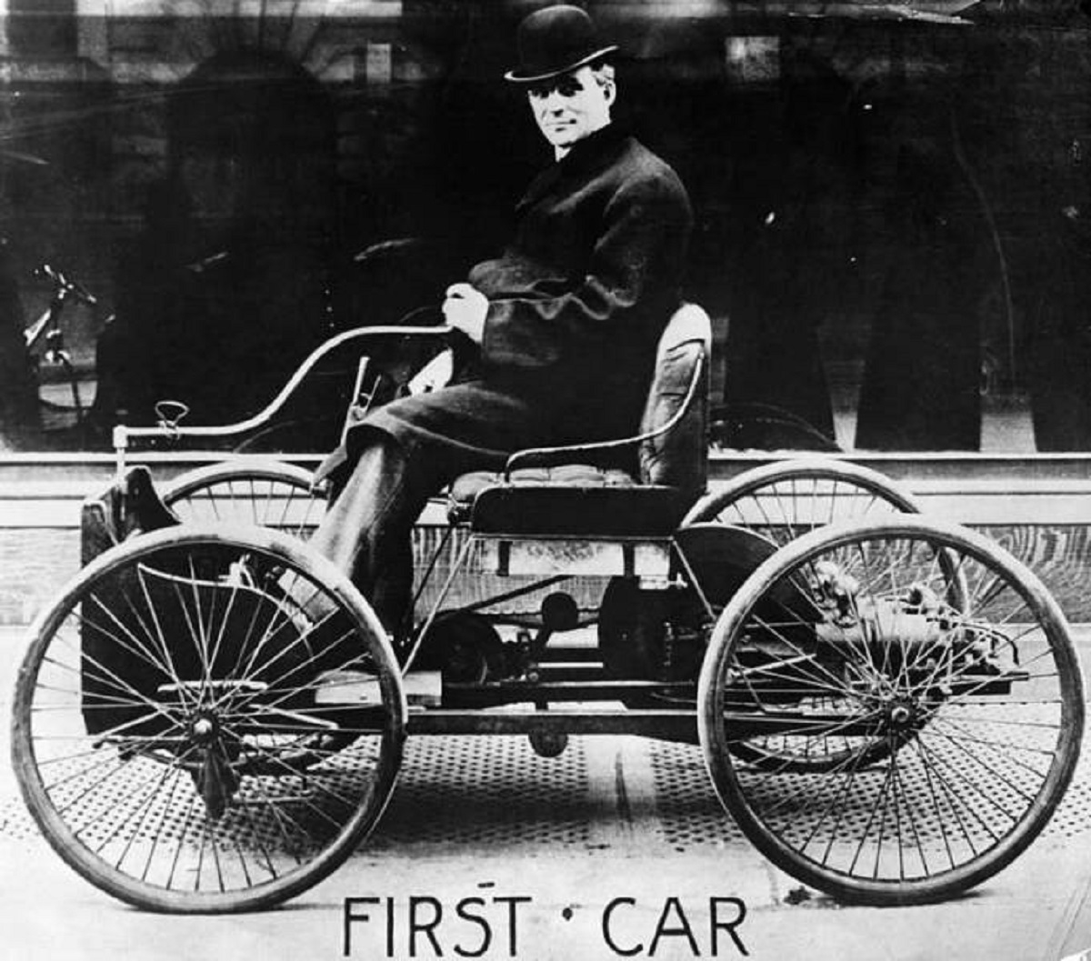 This is Henry Ford cruising around in the first car he designed, the Quadricycle: