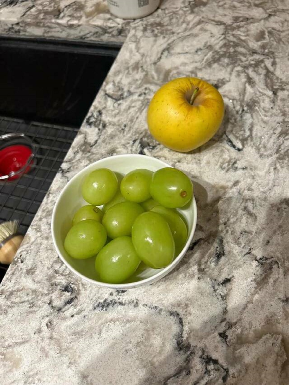 "The grapes I bought are the size of baby potatoes. Apple for scale"