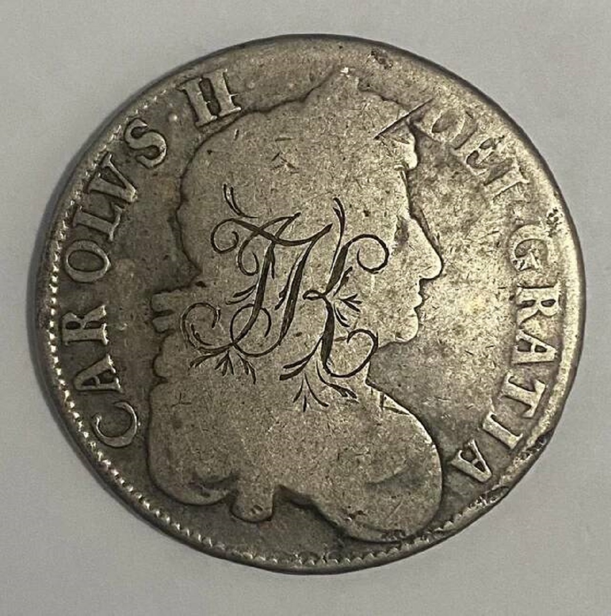 "Someone engraved their initials into this 350 year old coin"