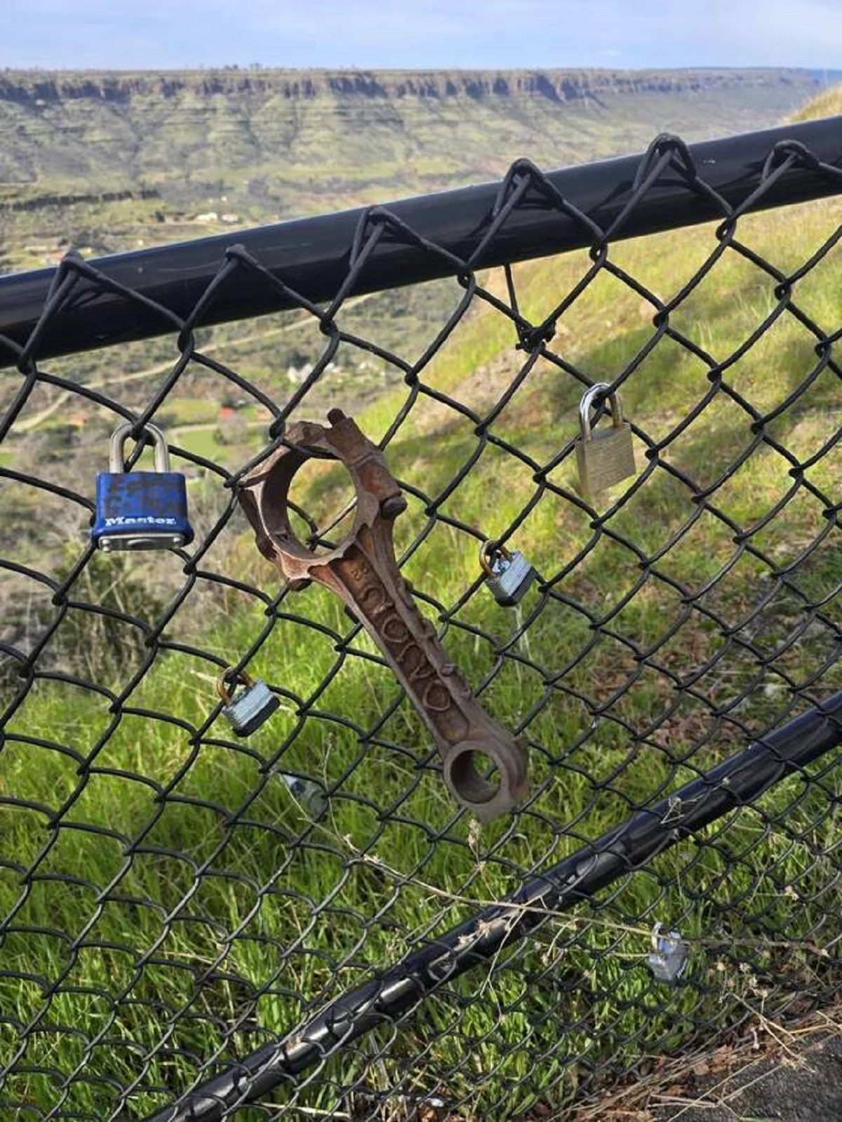 "Someone put an engine connecting rod on the fence people usually put locks on"