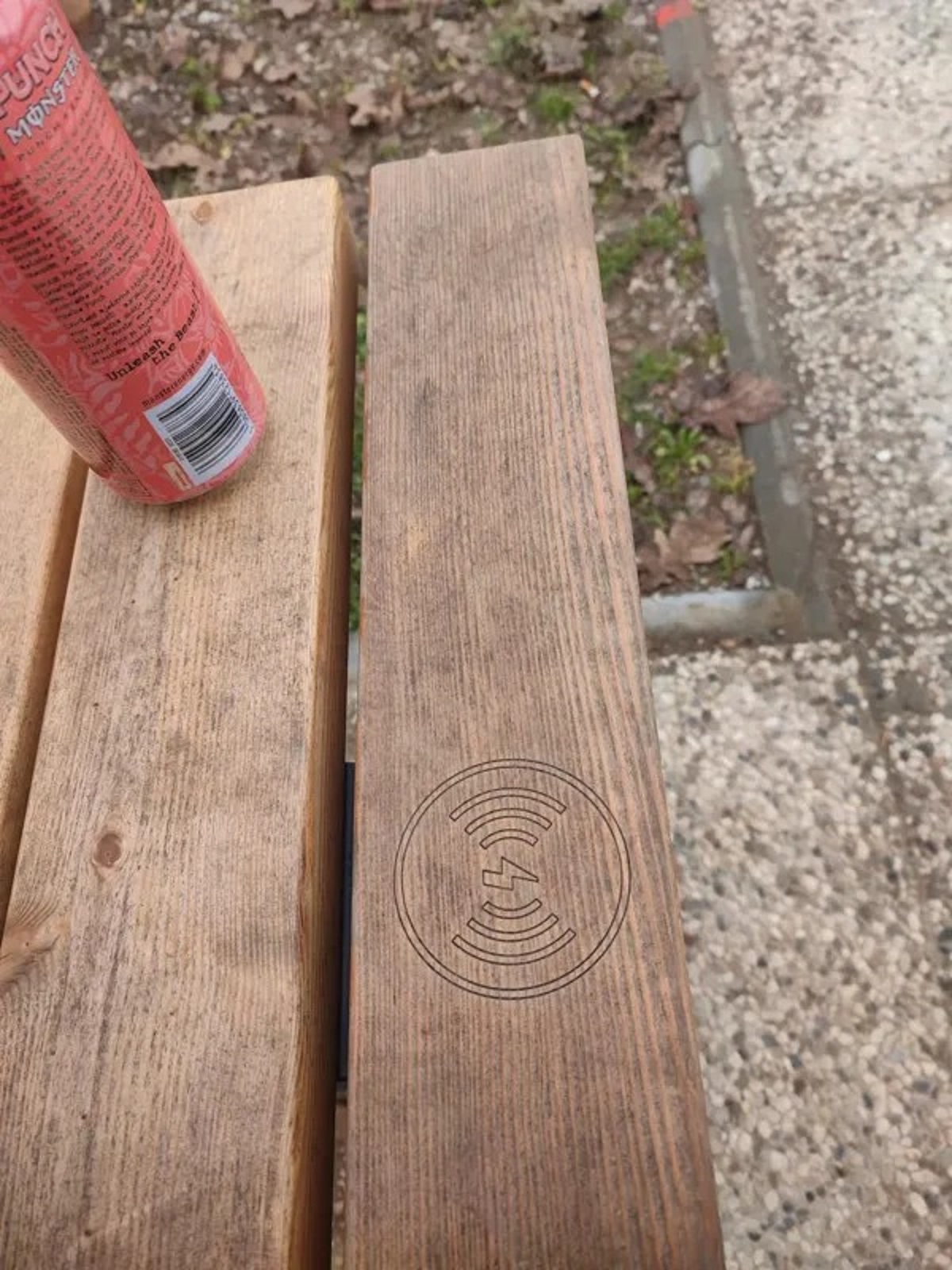 A few benches in my city have wireless Qi pads and USB power ports on them.