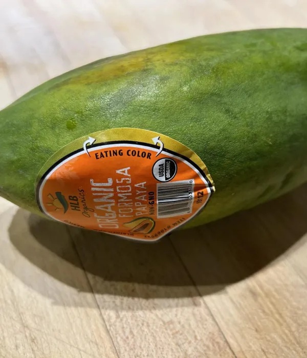 This papaya has an “eating color” sticker to let you know when it’s ripe