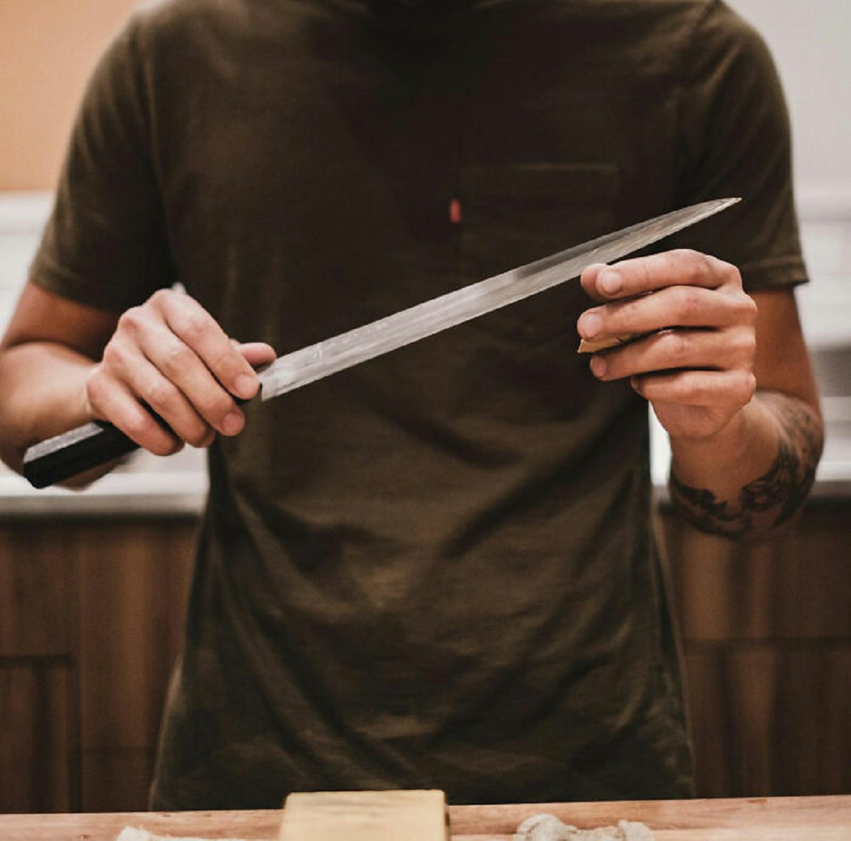 The bottom of a ceramic coffee cup is great for sharpening knives. Hold the knife against one side of the exposed ceramic ring, raise 15 degrees, and carefully slice forward scraping the knife against the bare ceramic. 5-6 strokes on each edge usually works for me.