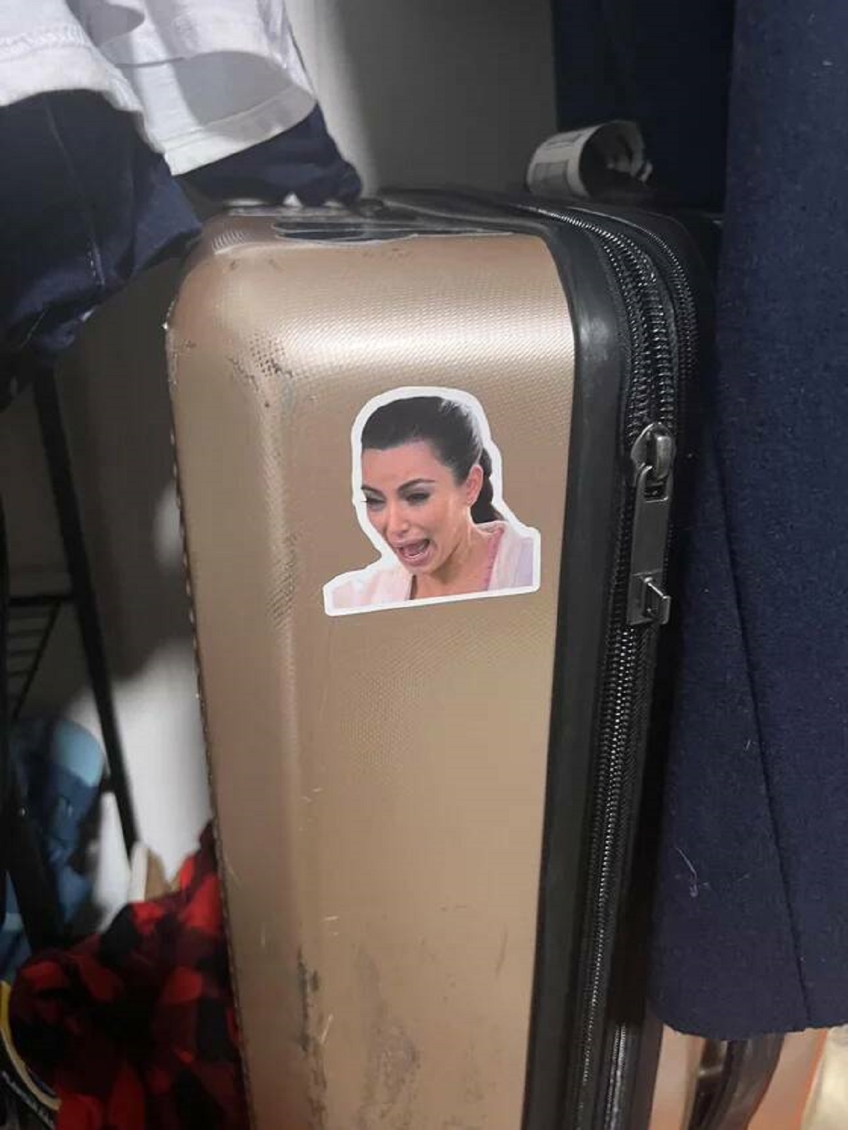 "I have stickers on my suitcase… someone added this one last time I flew"