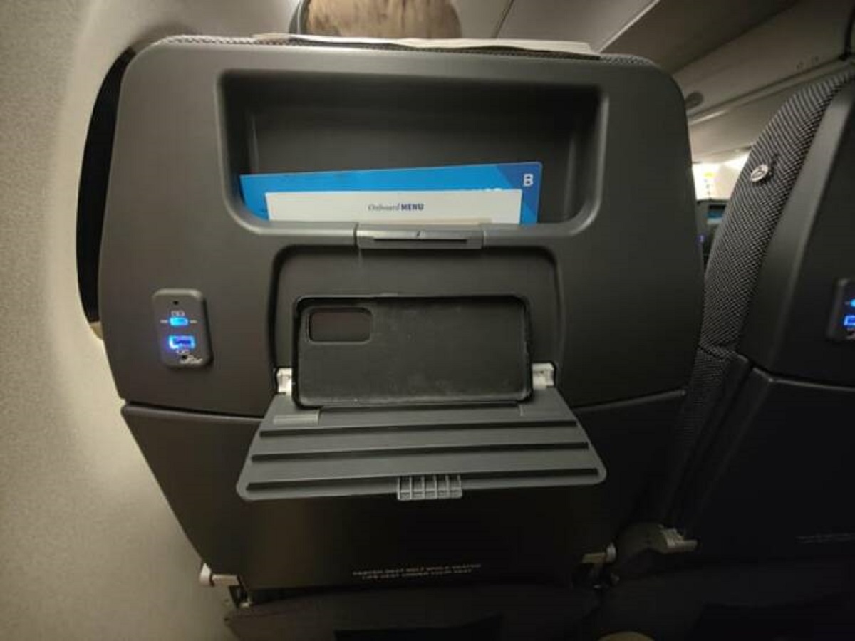 "These plane seats have built in phone/tablet holders"