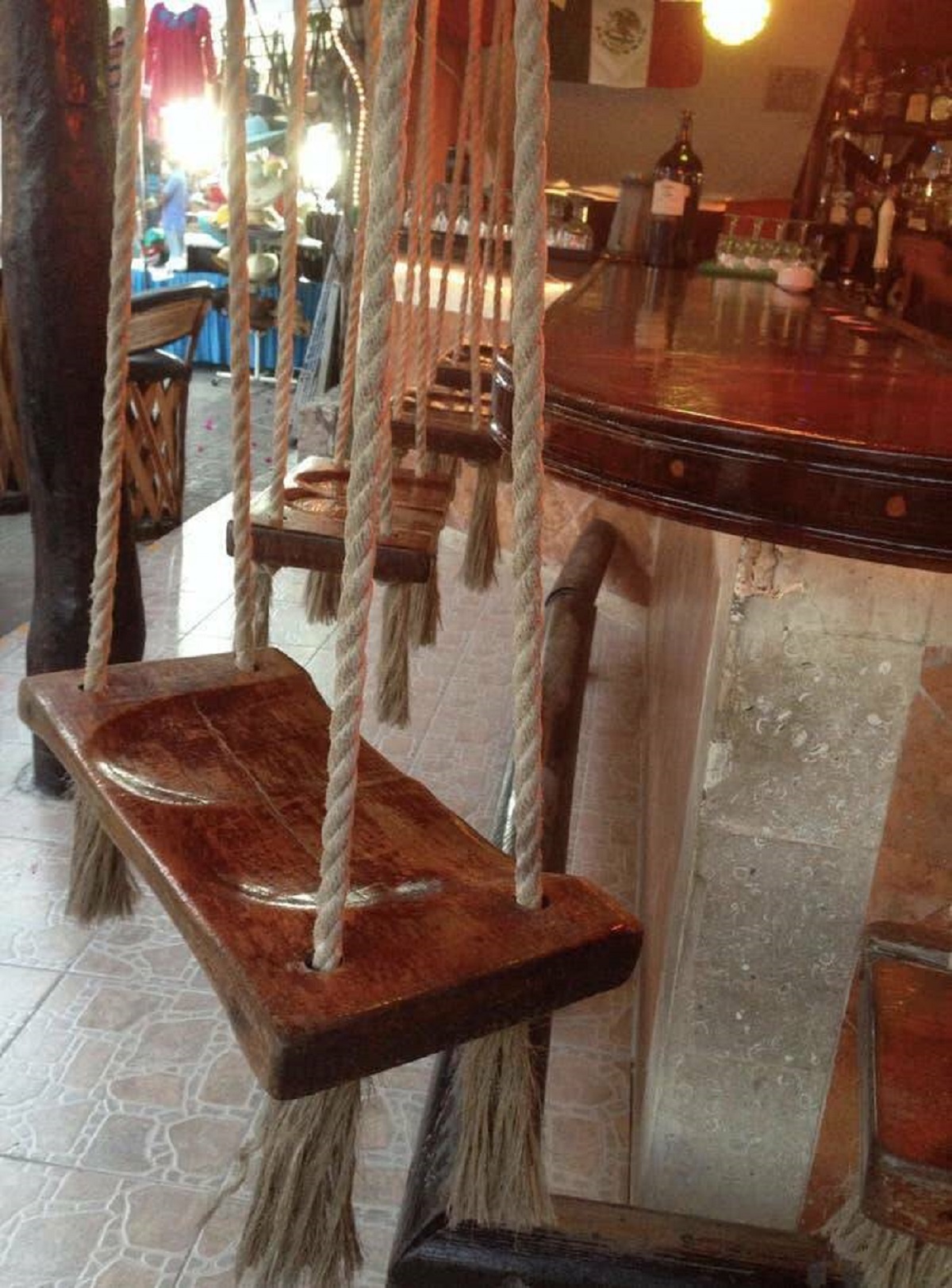 I need to go to this bar in Mexico with swings for chairs immediately.