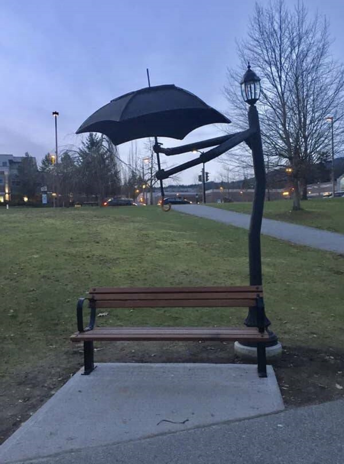 In British Columbia, benches have cute stands with umbrellas in case it's raining.