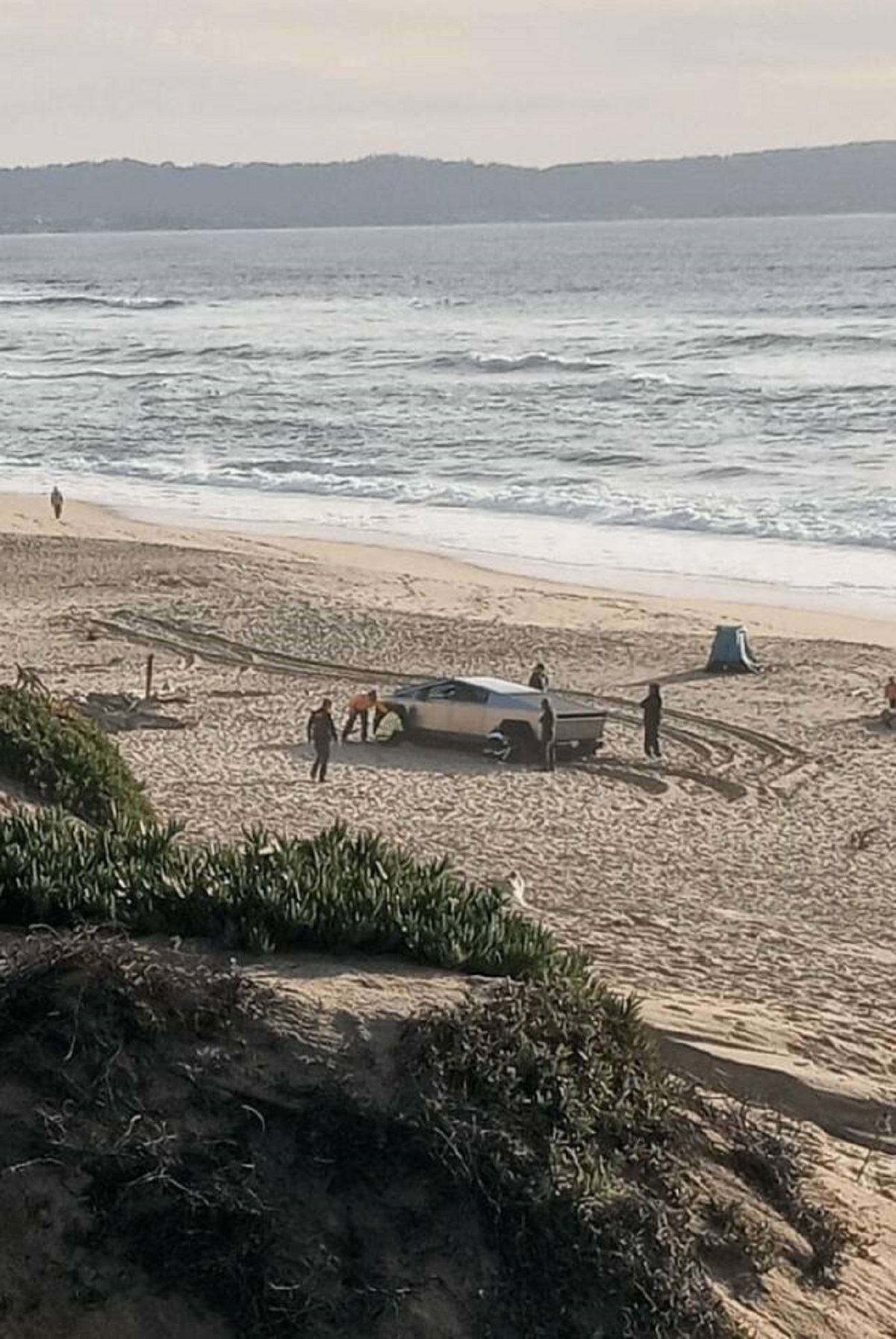 "A tesla truck got stuck on my local beach"