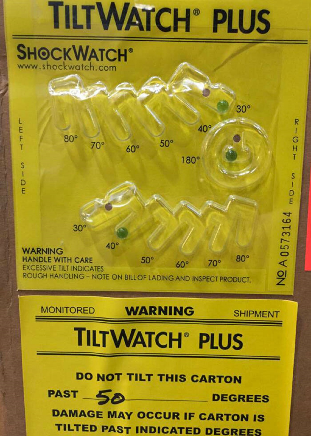 "This Sticker Lets The Person Receiving This Cargo Know How Many Degrees It Was Tilted Based On Where The Green Beads Are"