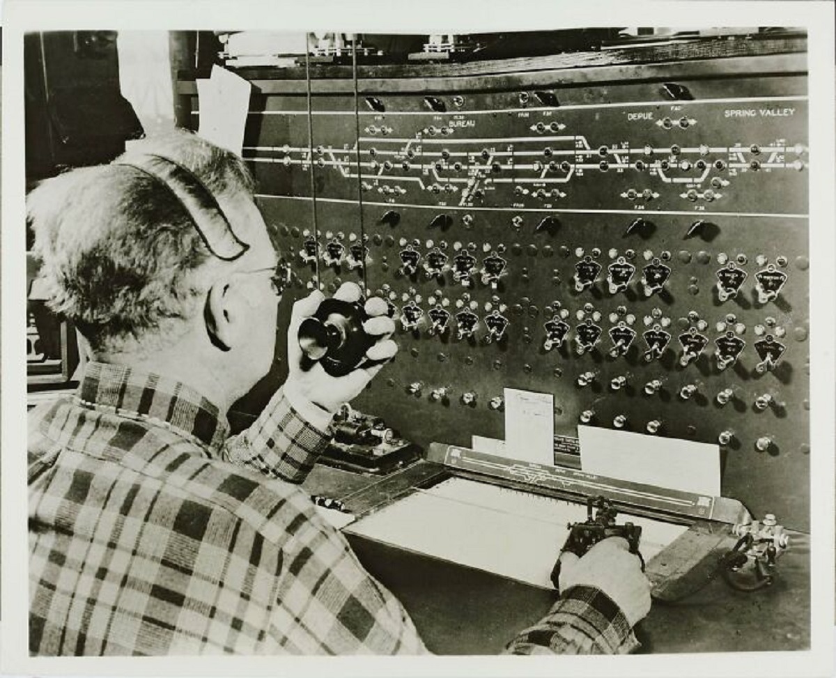 A central control operator directs progress of trains, throws switches, and sends train operators 1930 Chicago, Kaufmann & Fabry Co. (Chicago)