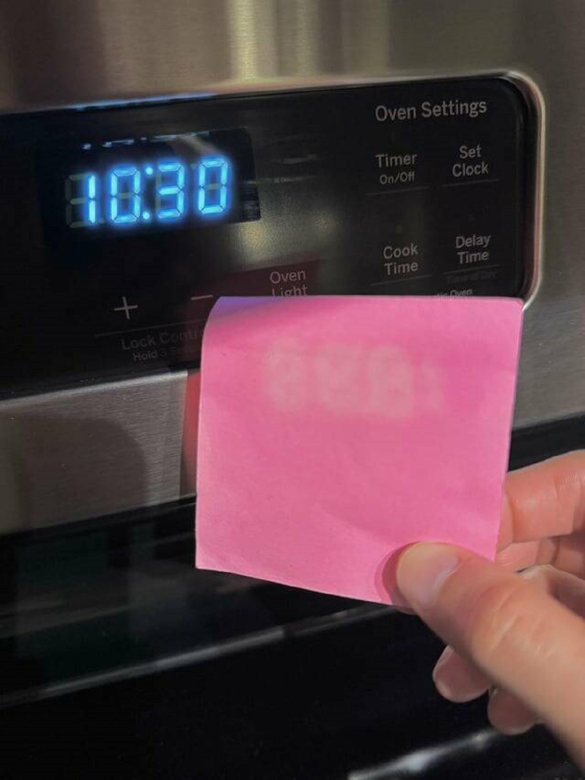 "I use a sticky note to dim my stove clock at night and it leaves an afterimage on it."