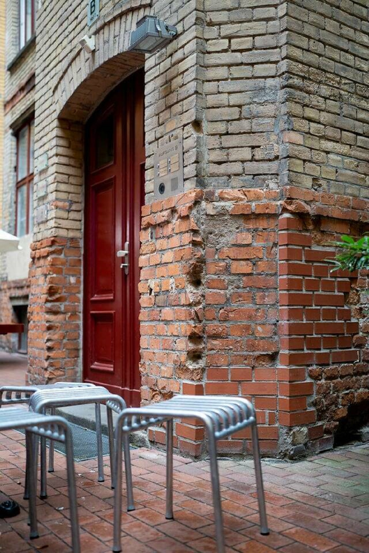 "Bullet holes from World War II in a courtyard in Berlin, Germany"