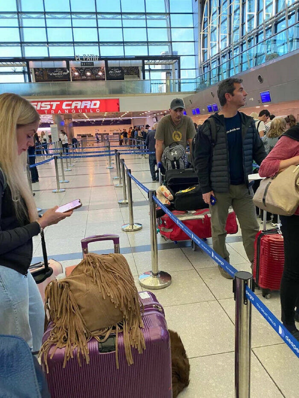woman not moving in airport line