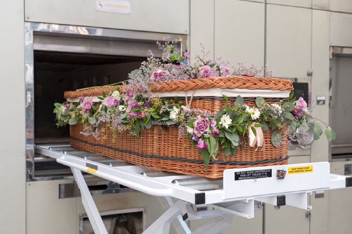 A dead body will often move as its being cremated. Muscles contract as they cook, after all. Sometimes this means a body will sit up in the crematory machine.