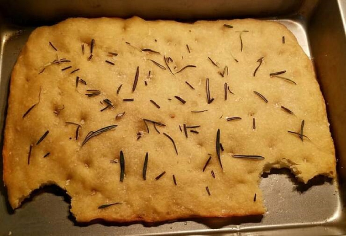 "My brother's visiting, I made foccacia & told him to take a bite while it's warm and I came back to this monstrosity"