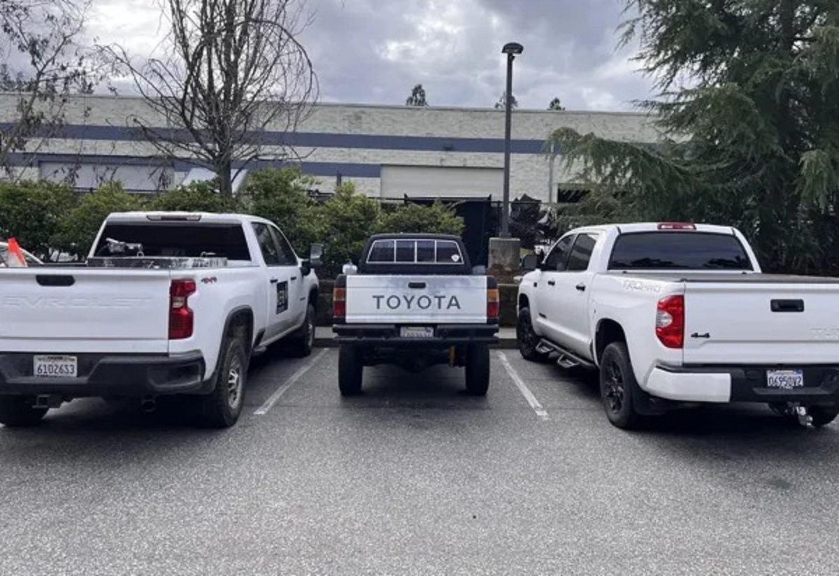 My dads ‘85 pickup in between 2 modern pickups.