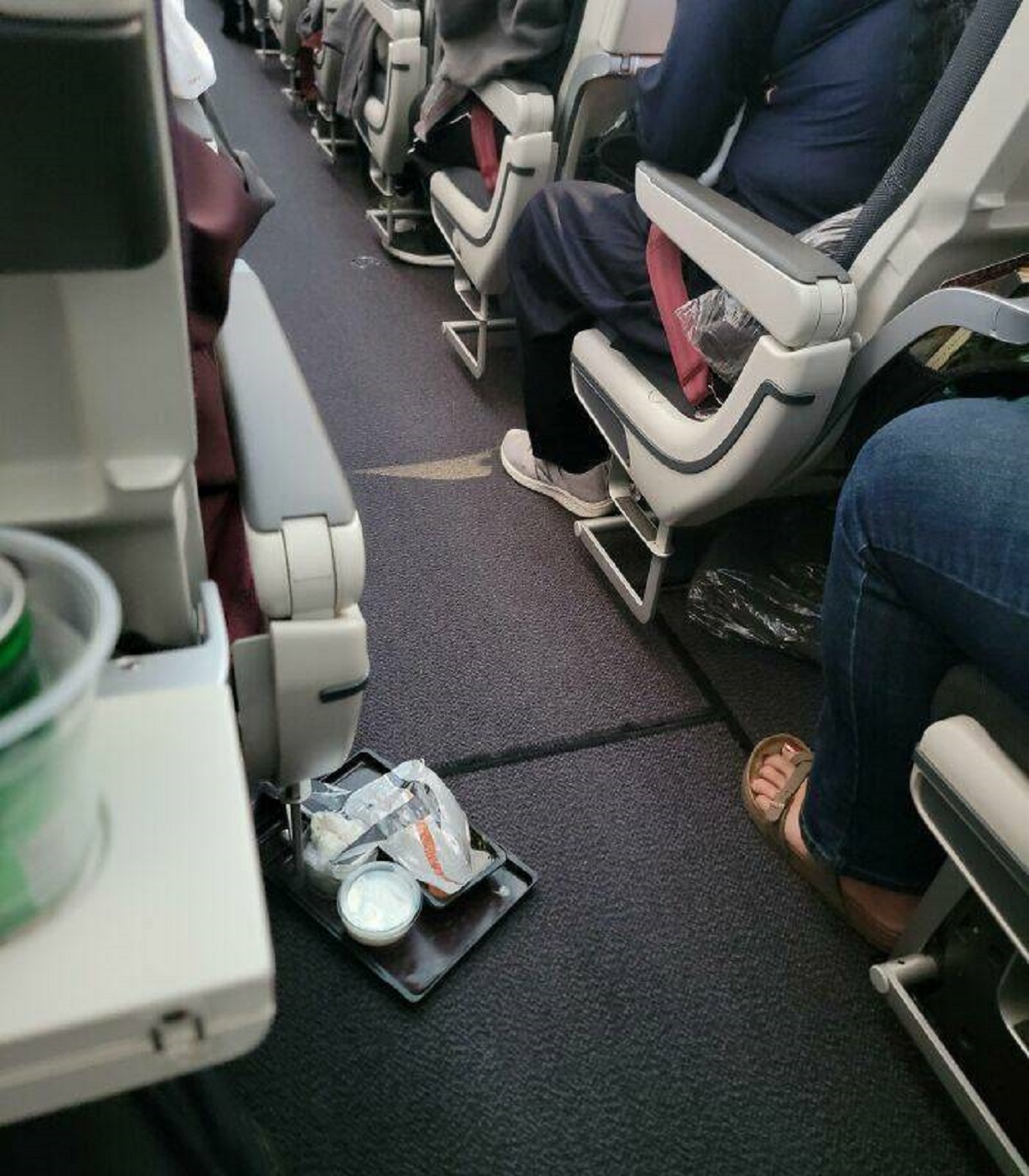 "This Woman Just Dropping Her Food Tray In The Middle Of The Aisle Of The Plane"