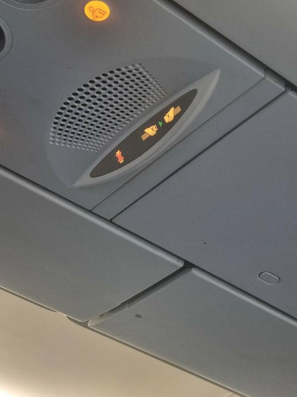 "This plane has a no phone sign instead of no smoking!"