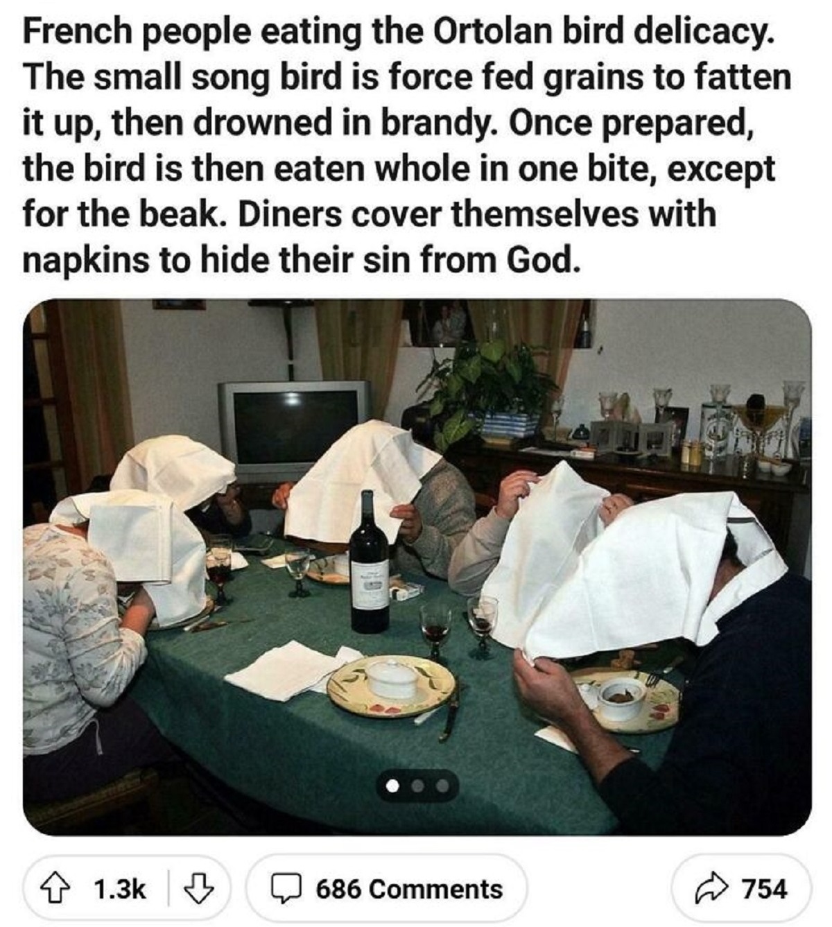 drowned bird in brandy - French people eating the Ortolan bird delicacy. The small song bird is force fed grains to fatten it up, then drowned in brandy. Once prepared, the bird is then eaten whole in one bite, except for the beak. Diners cover themselves