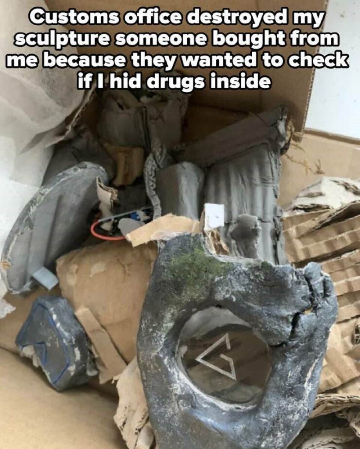 photo caption - Customs office destroyed my sculpture someone bought from me because they wanted to check if I hid drugs inside V