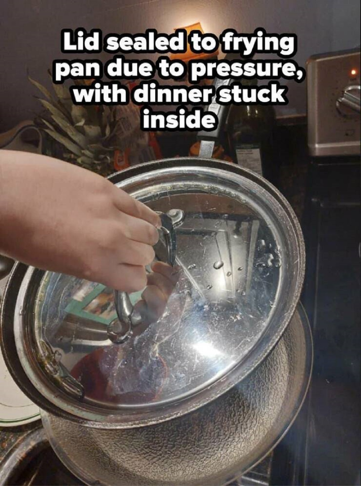 lid stuck on pan - Lid sealed to frying pan due to pressure, with dinner stuck inside