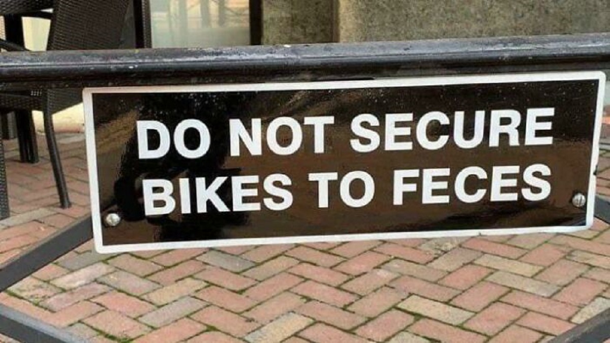 street sign - Do Not Secure Bikes To Feces