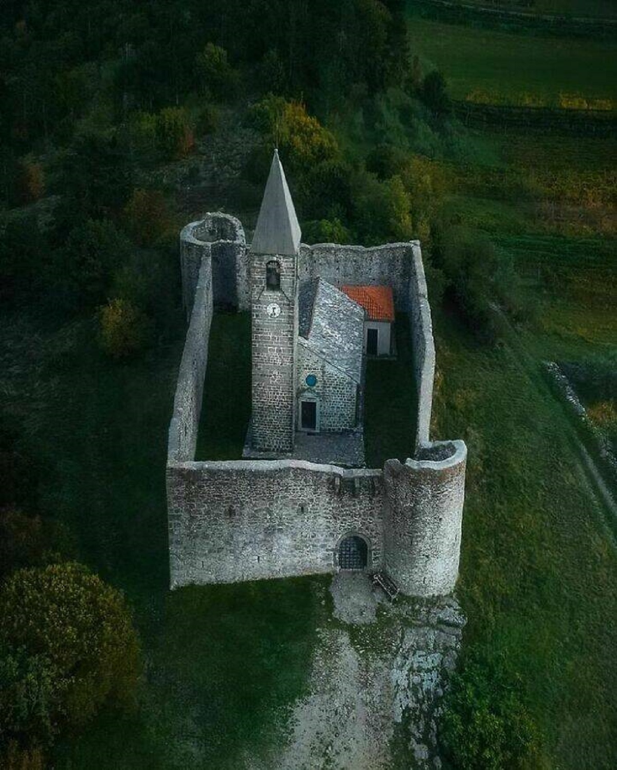 "Holy Trinity Church, A Historical Building In Hrastovlje, A Village In Southwestern Slovenia, It Is A Romanesque Church From 12th Century Ce. Church Stands Behind A Wall That Local Population Built To Protect Itself From Turkish Attacks In 16th Century Ce"