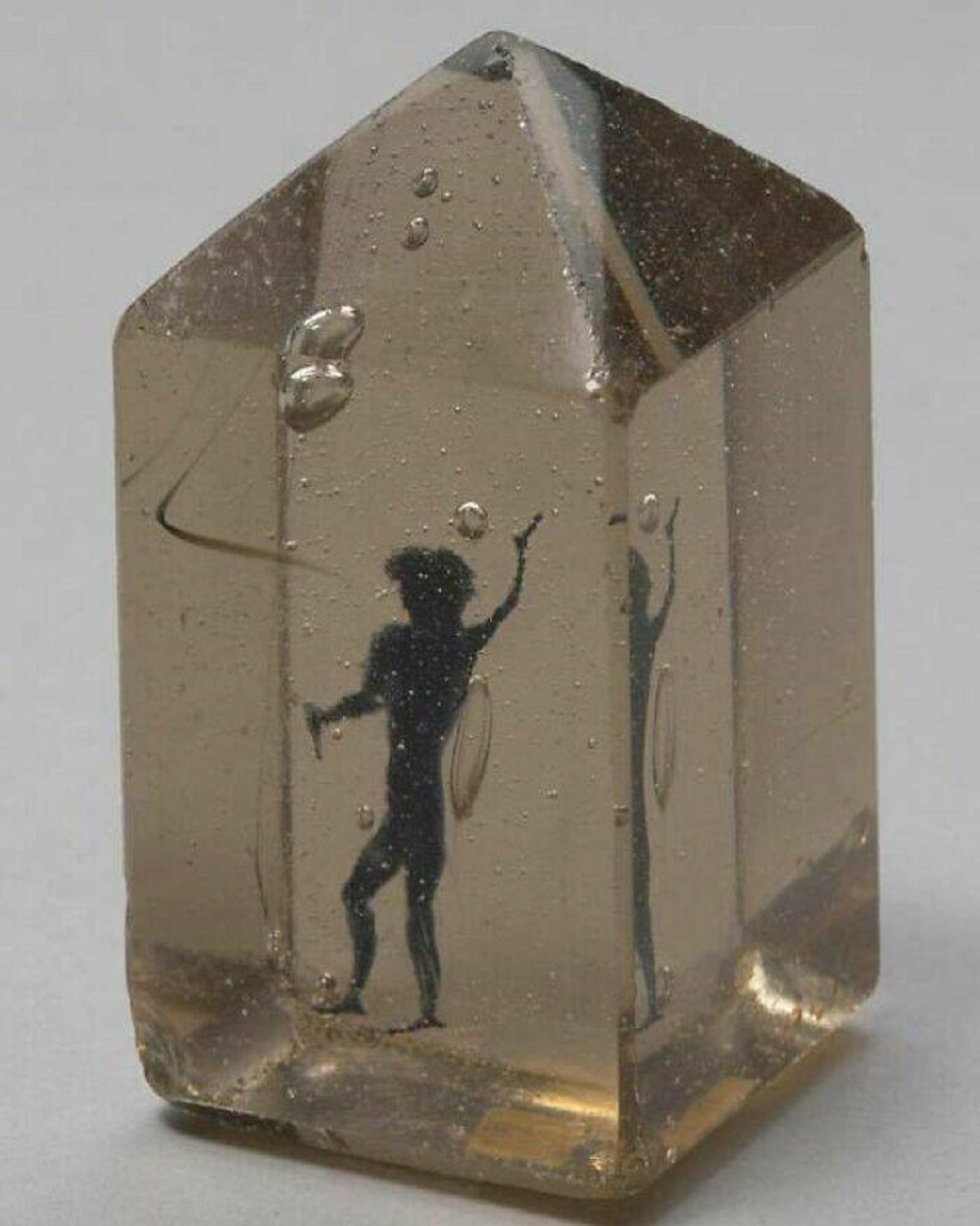 ""Devil In The Glass". Cast In Glass, The Small Figure Of A Devil Is Made Of Black Lead"