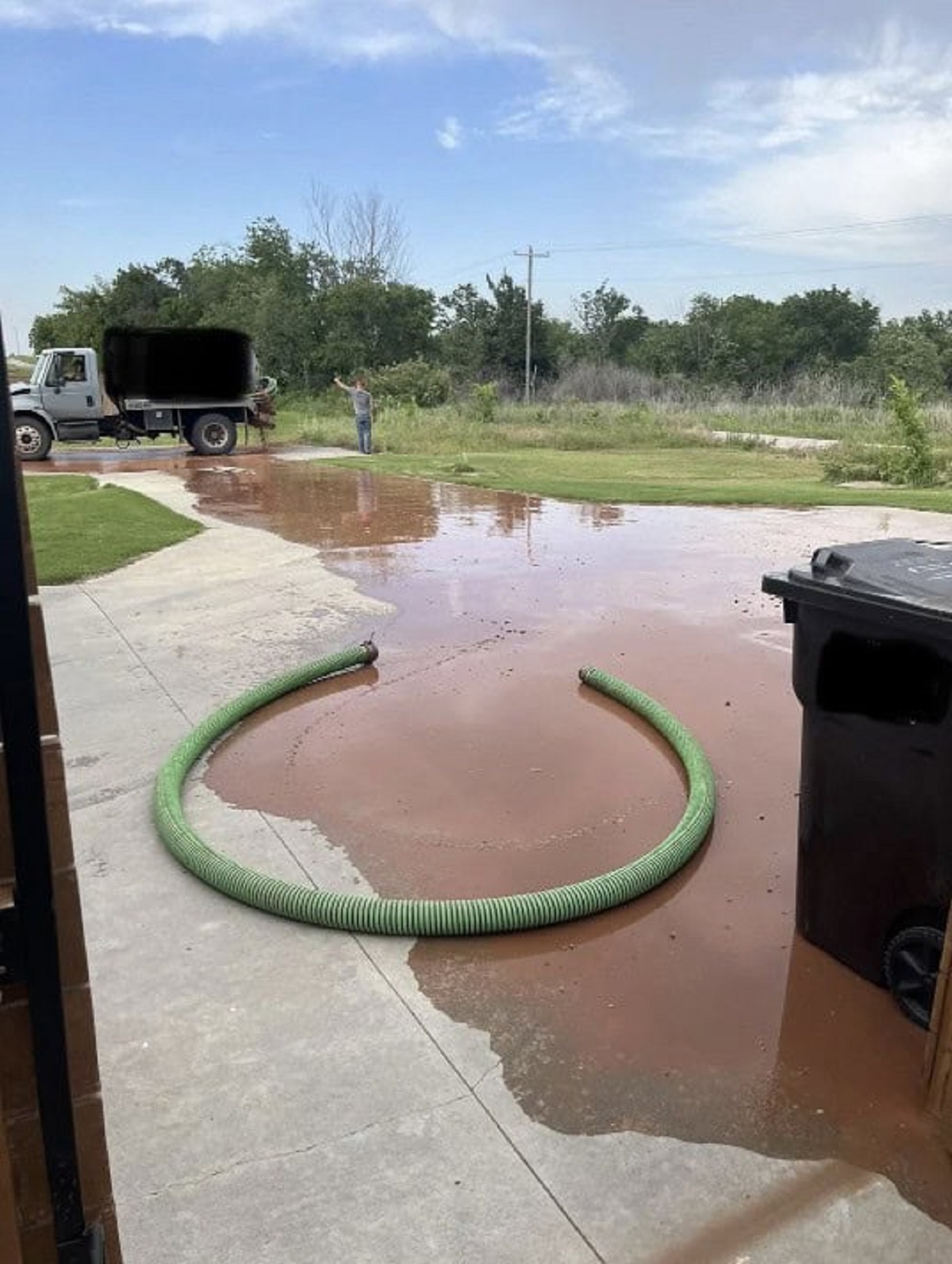 Sewage truck busted open in our driveway.