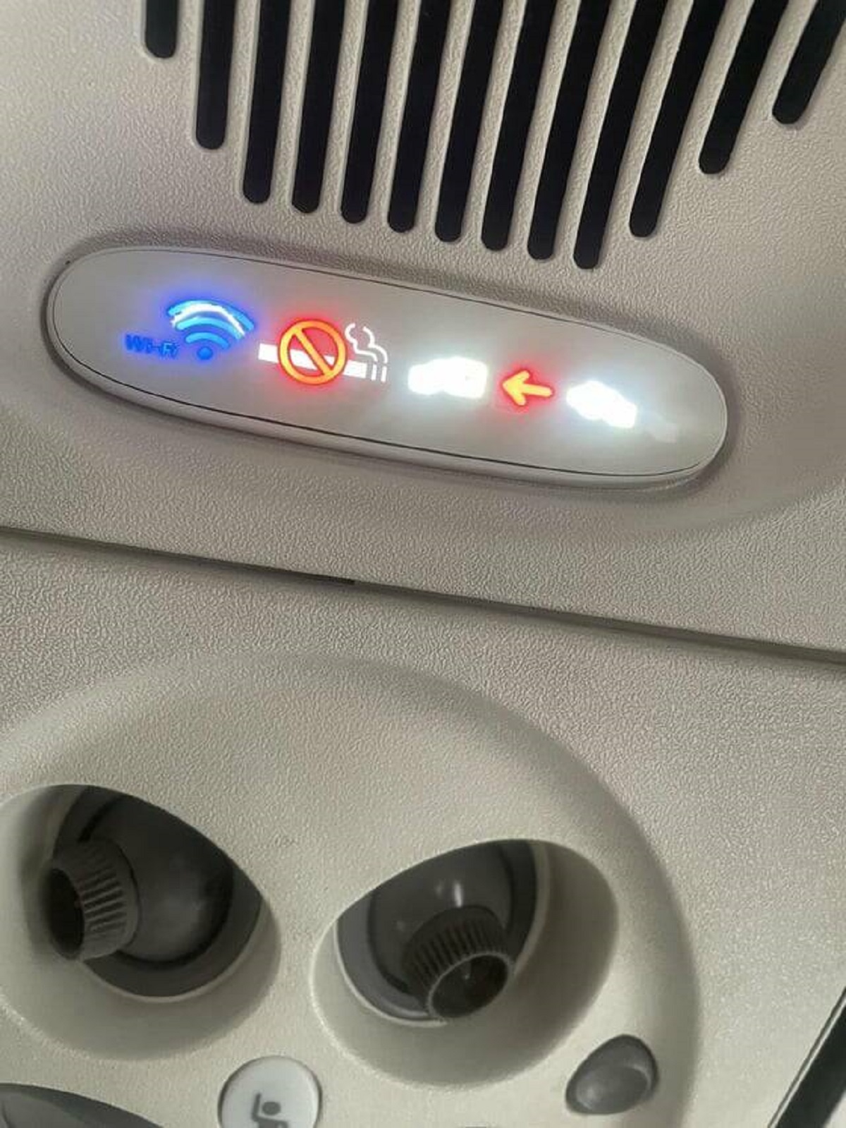 "WiFi indicator on a plane, broken by people pressing it for “free WiFi”"