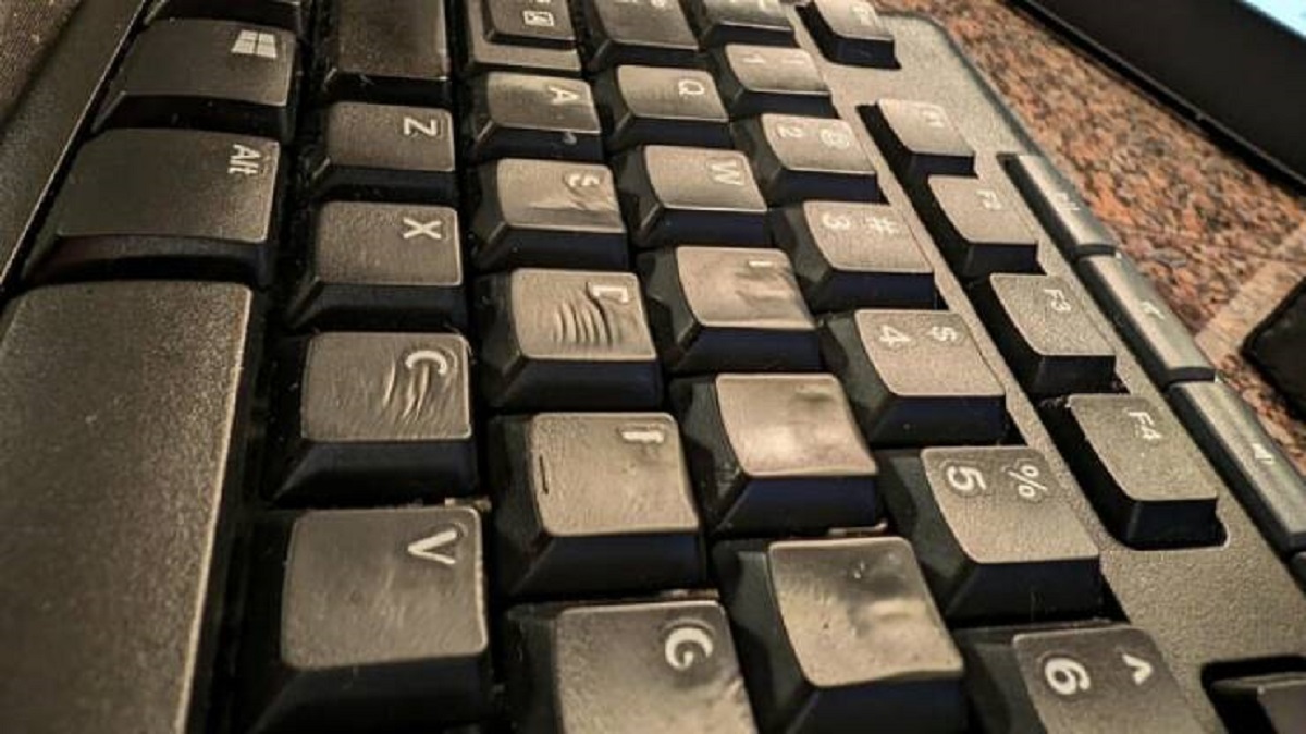 "You can see the fingernail marks on my wife's work keyboard from how much she types (faded lettering too)"