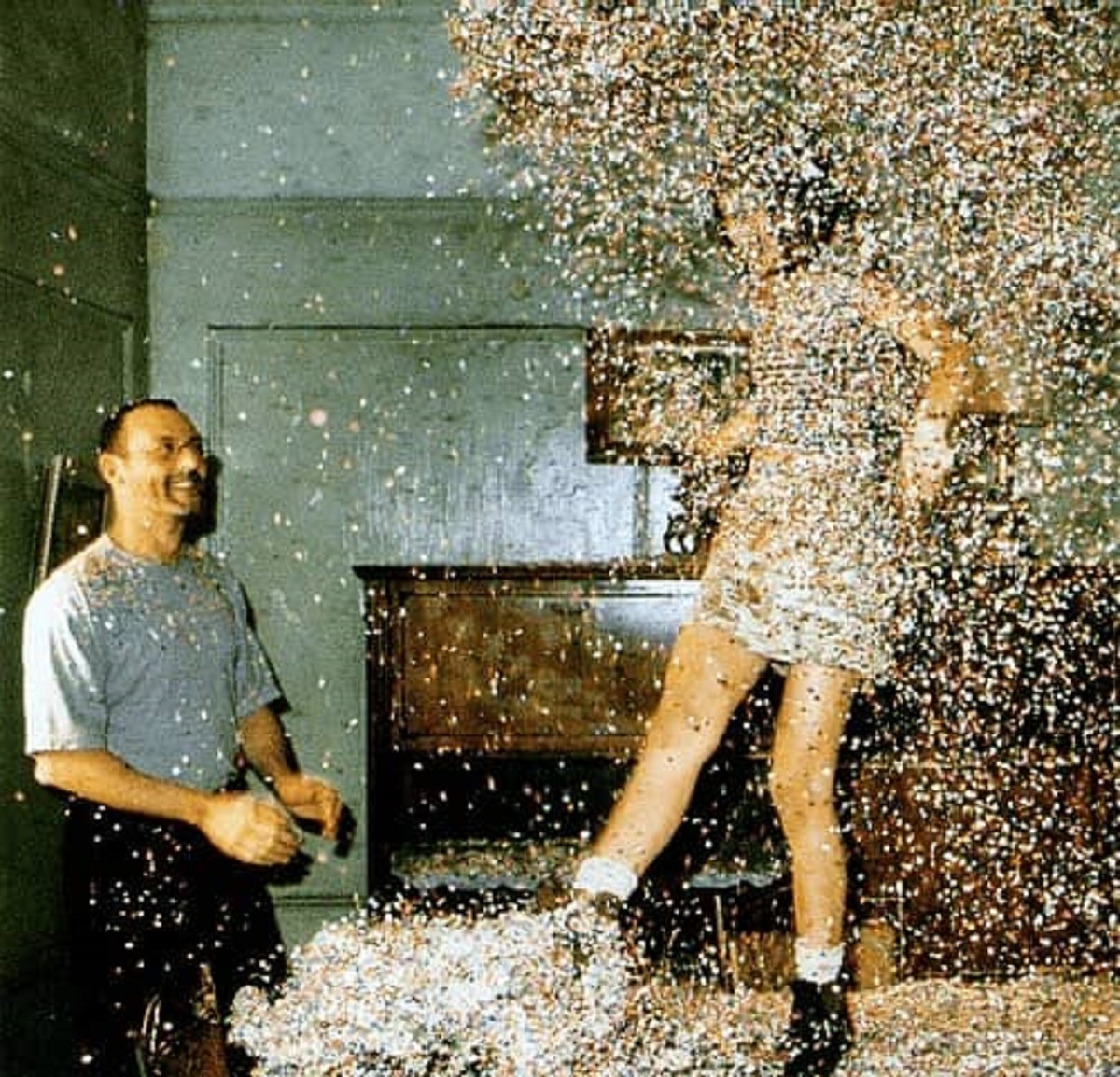 Jean Reno and Natalie Portman goof off with confetti to celebrate the end of filming Léon: The Professional in 1994.