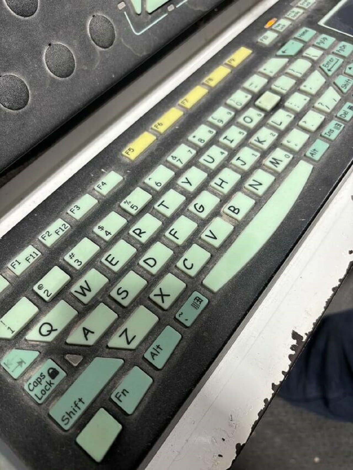"Keyboard on a machine uses comic sans font"