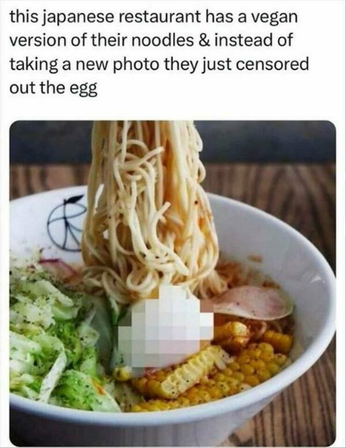 ramen egg censored - this japanese restaurant has a vegan version of their noodles & instead of taking a new photo they just censored out the egg