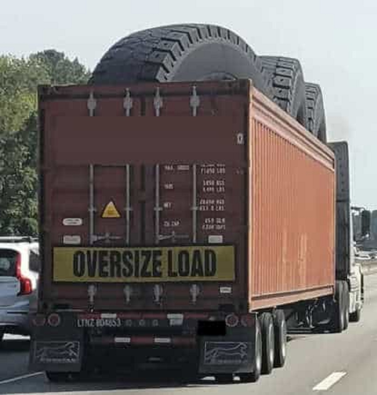 You needed to move some XL tires? Truck hauling extremely large tires.