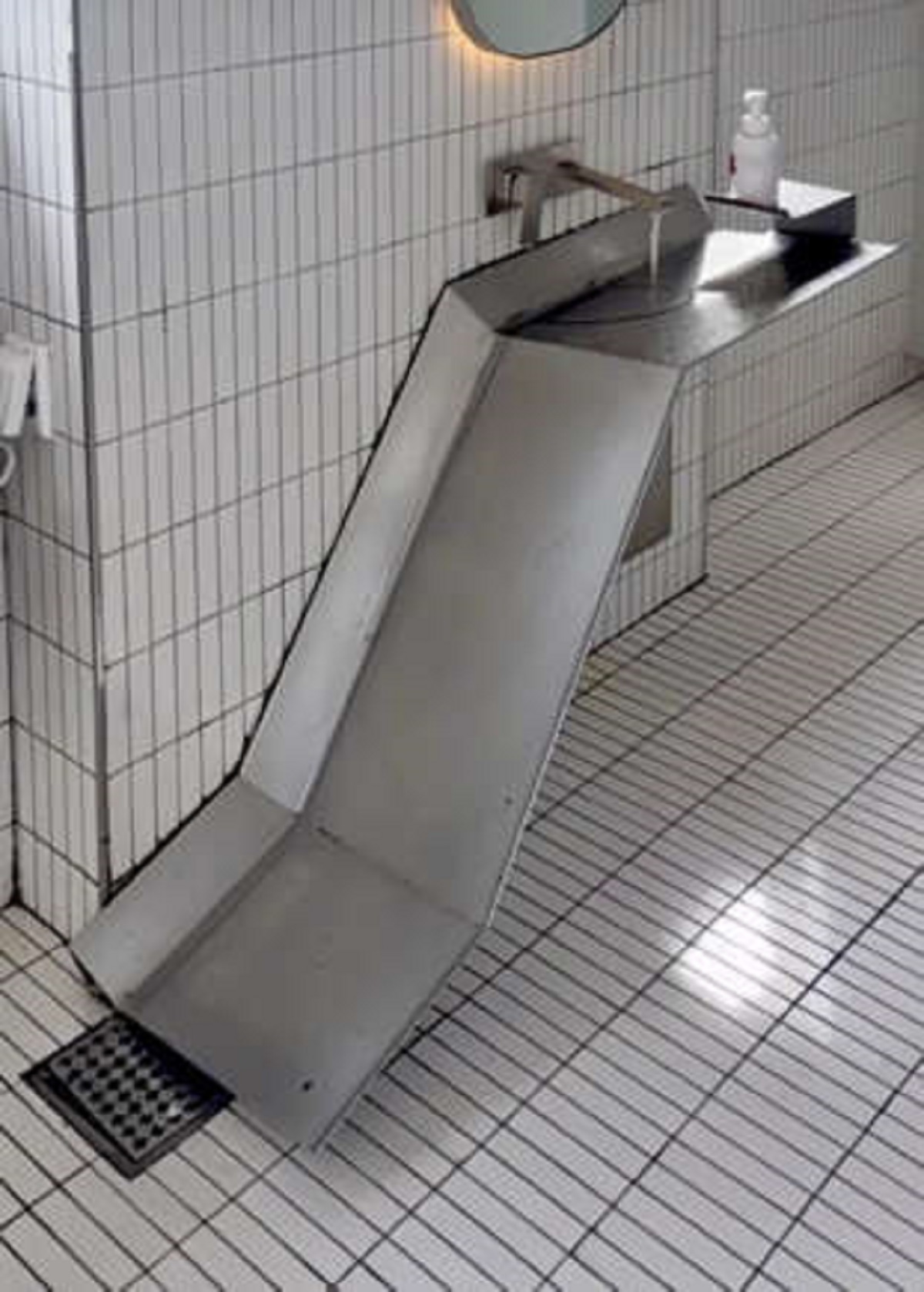 A sink drained to the floor? Sink for handwashing drains straight to the floor.