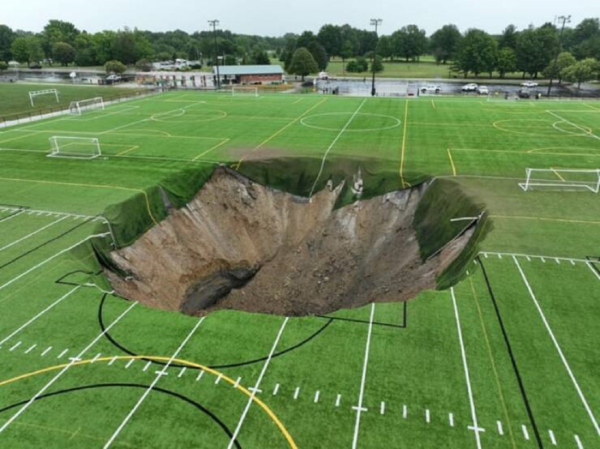 "Sinkhole in the middle of a soccer field"