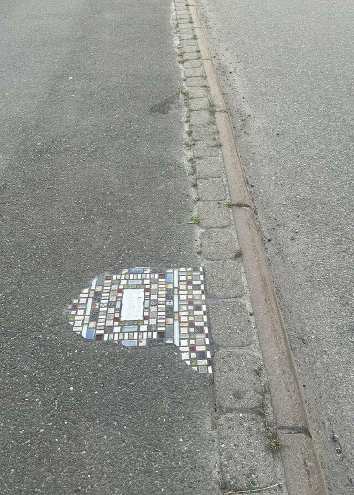 "My city has recently been filling small potholes with tiles like"
