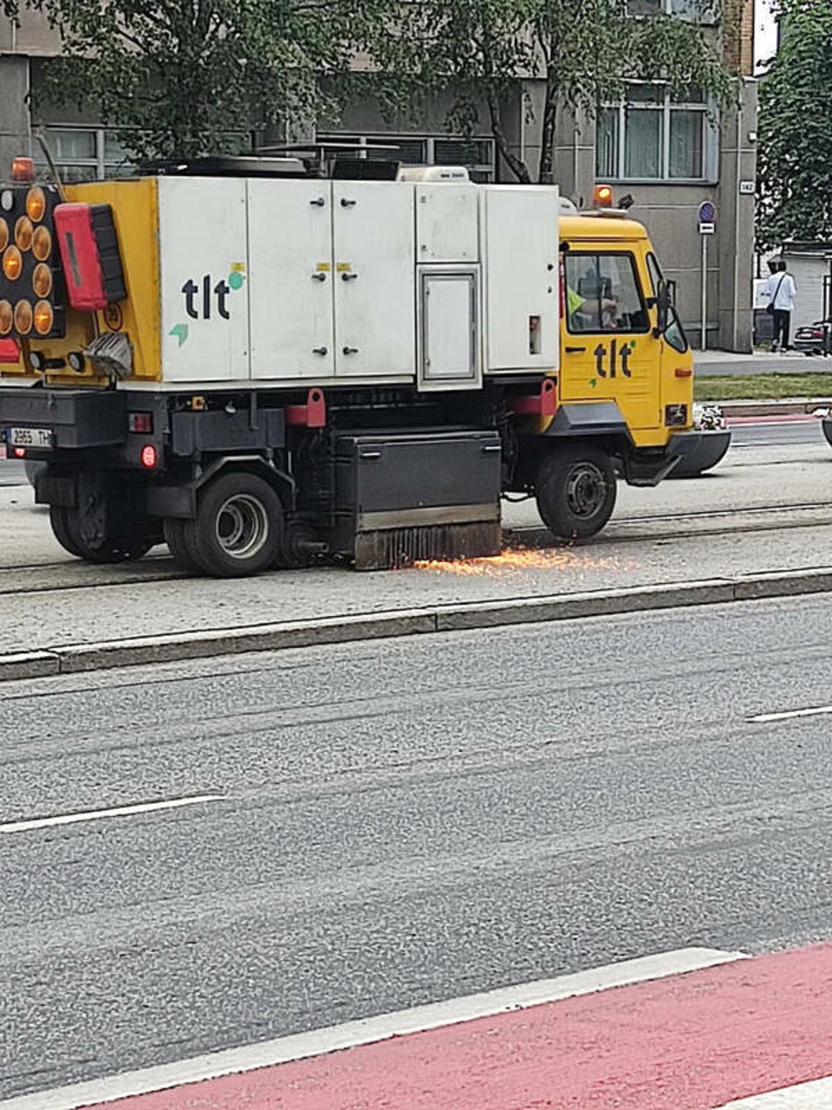 "Train tracks are cleaned with grinder."