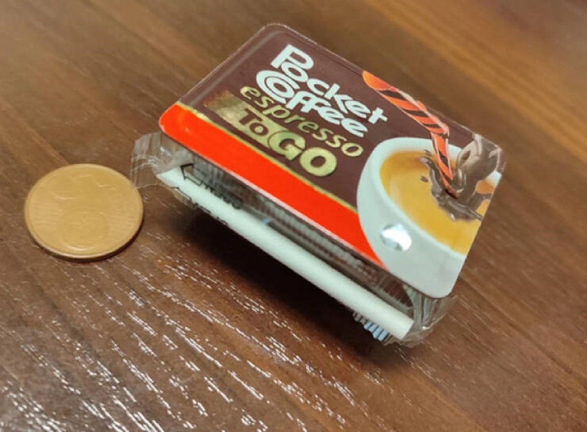 "You can buy tiny juice boxes with espresso shots in Italy (5€ coin for scale)."