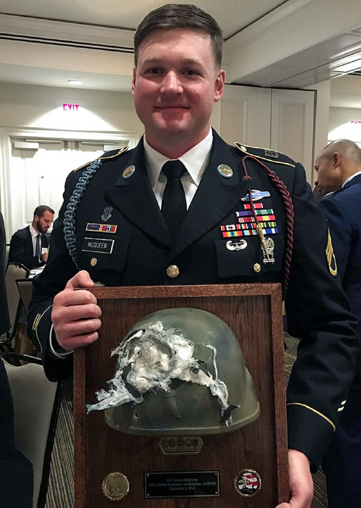 soldier holding helmet