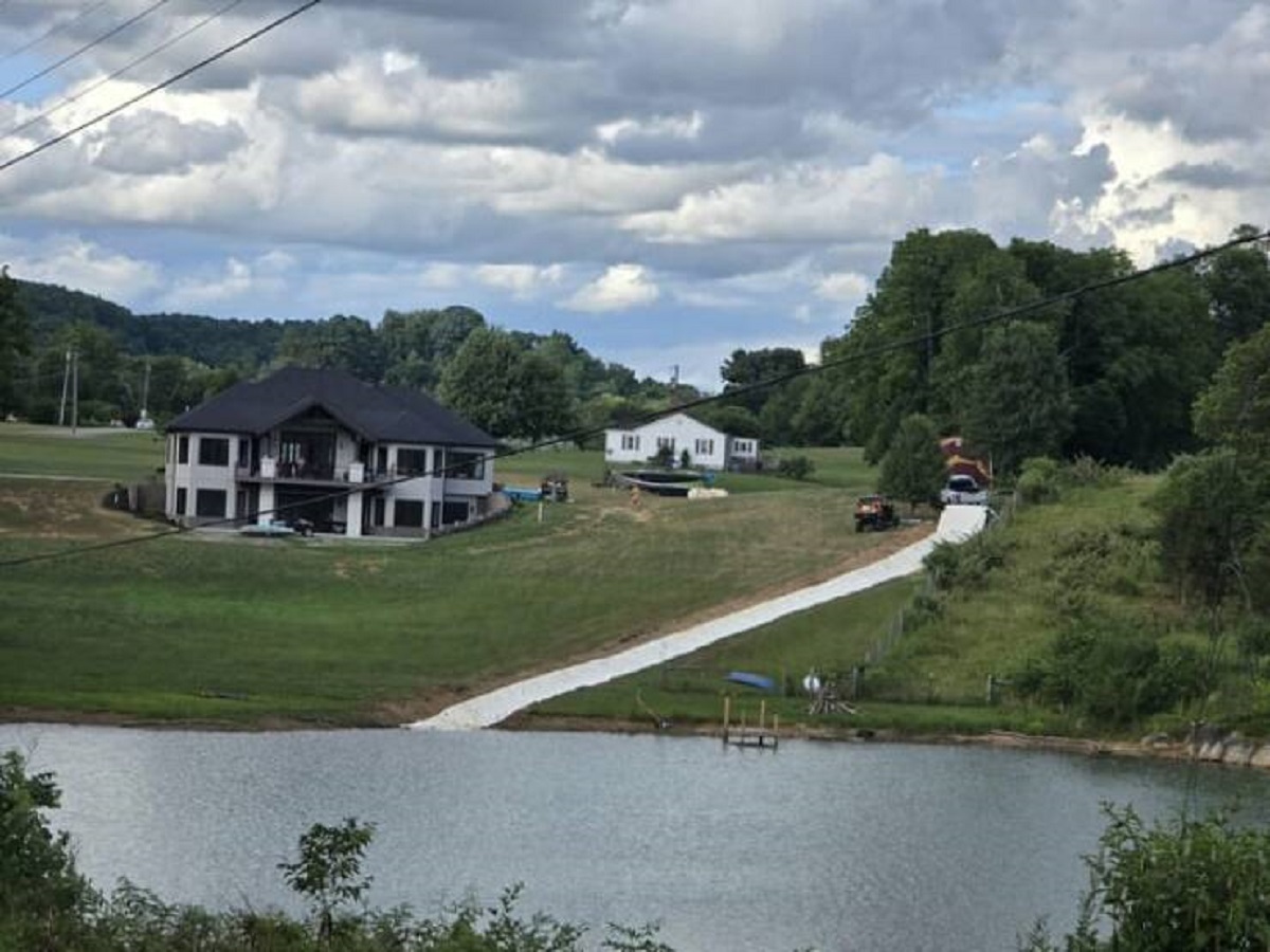 "Brand new home near my house with a handmade waterslide into the lake."