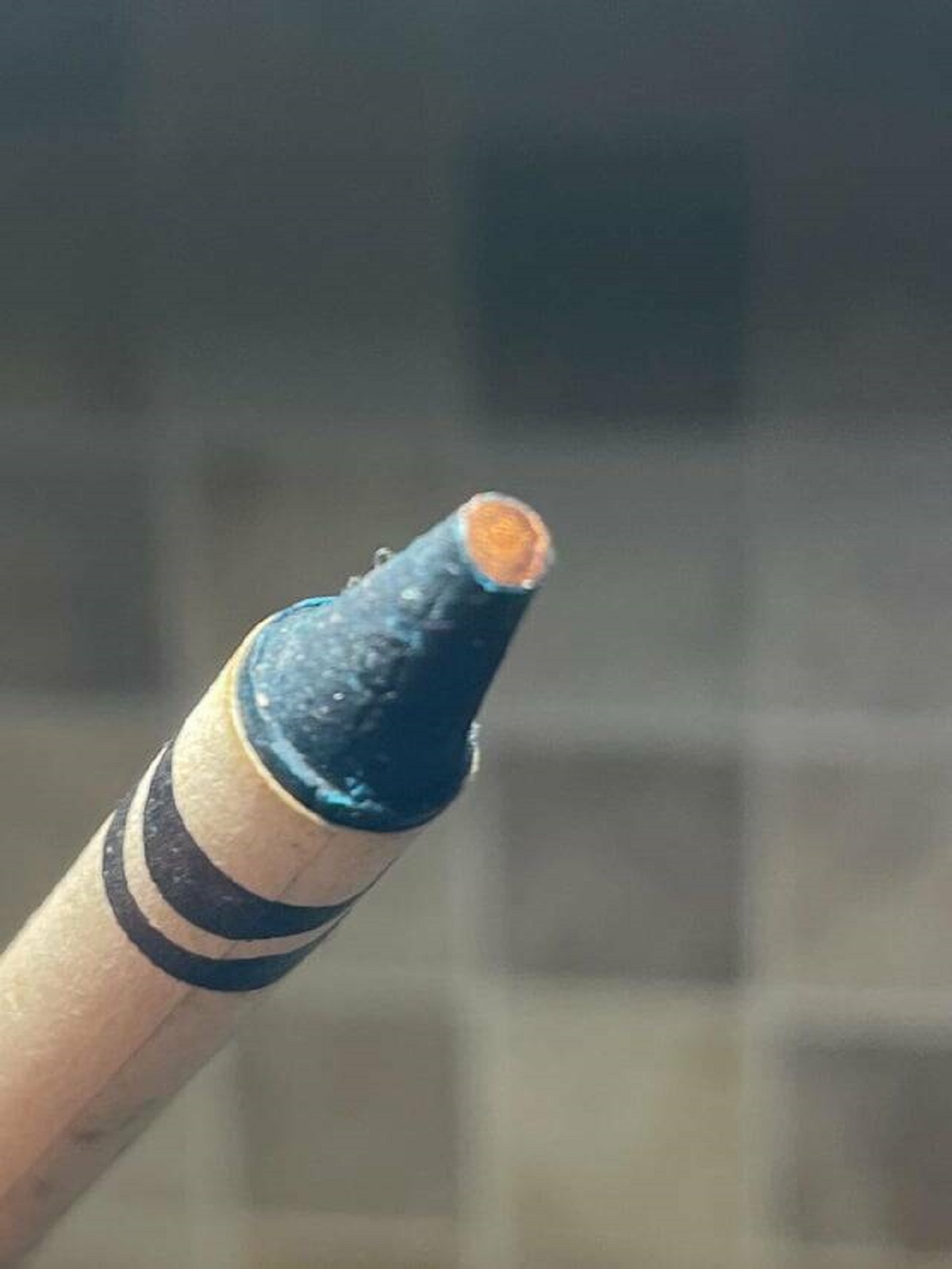 "Copper crayon from a 1990 box of Crayolas that has apparently oxidized"