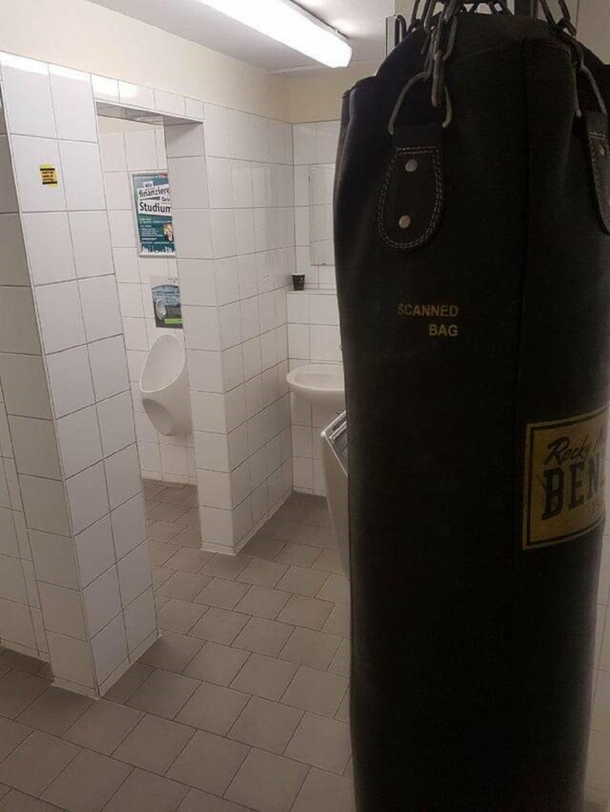 "This punching bag in the mans restroom of a berlin bistro"