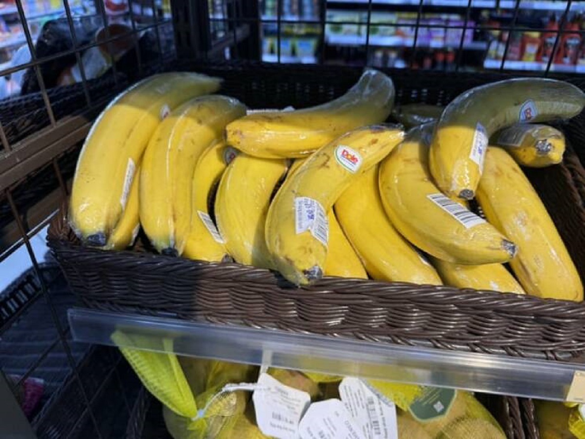 "Individual bananas wrapped in plastic in Vietnam"