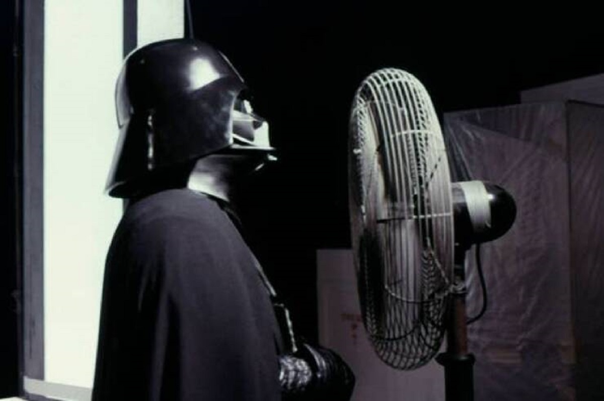 Here's a behind-the-scenes photo of Dave Prowse in the Darth Vader costume, trying to cool off during the filming of Star Wars: A New Hope: